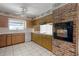 Charming kitchen with vintage cabinetry, tile countertops, and a built-in oven at 900 Howard Nw Ter, Winter Haven, FL 33881