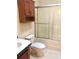 Bathroom featuring a vanity, toilet and glass shower enclosure, offering essential amenities at 9625 Moore Rd, Lakeland, FL 33809