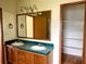 Bathroom vanity with double sinks and cabinet storage, providing practical and stylish features at 9625 Moore Rd, Lakeland, FL 33809