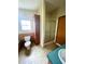 Functional bathroom featuring tiled floor, a toilet, cabinet and a glass-doored shower for convenience at 9625 Moore Rd, Lakeland, FL 33809