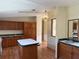 Traditional kitchen with wood cabinets and island features a sink with light green countertops at 9625 Moore Rd, Lakeland, FL 33809