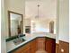 Cozy view of kitchen and living area with sink, fireplace, and laminate floors at 9625 Moore Rd, Lakeland, FL 33809