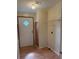 Functional laundry room with shelving, utility closet, and vinyl flooring for easy maintenance at 9625 Moore Rd, Lakeland, FL 33809