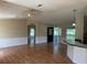 Spacious living room with front door entrance and beautiful hardwood flooring at 9625 Moore Rd, Lakeland, FL 33809