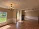 Spacious living room features natural light, a fireplace, and hardwood flooring throughout at 9625 Moore Rd, Lakeland, FL 33809