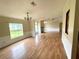 Spacious living room featuring hardwood floors and a cozy fireplace for a warm and inviting atmosphere at 9625 Moore Rd, Lakeland, FL 33809