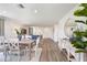 Spacious living area with dining table and chairs, flows into living room at 2242 Majestic Span Ave, Eagle Lake, FL 33839