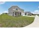 Charming two-story home with a well-maintained lawn and a two car garage at 3508 Dahlia Dr, Haines City, FL 33844