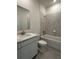 Bathroom features vanity with solid surface countertops and tub-shower with tiled walls at 6107 Sw 115Th Street Rd, Ocala, FL 34476
