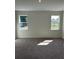 Bedroom with plush carpet and natural light from exterior windows at 6107 Sw 115Th Street Rd, Ocala, FL 34476