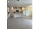 Bright, open kitchen featuring white cabinets, tile flooring, and a large island at 6107 Sw 115Th Street Rd, Ocala, FL 34476