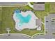 Bird's eye view of a clover-shaped pool, surrounding lounge area and nearby parking at 3429 Dahlia Dr, Haines City, FL 33844