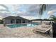 Inviting community pool area with comfortable lounge chairs and ample space for relaxation at 2203 Majestic Span Ave, Eagle Lake, FL 33839