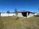 The house includes a well-kept lawn, a fenced-in yard and a covered patio to enjoy backyard cookouts at 2366 Aquiline Nest St, Eagle Lake, FL 33839
