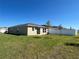 Spacious backyard with lush green grass and a new white privacy fence at 2374 Aquiline Nest St, Eagle Lake, FL 33839