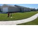 Well-manicured front yard showcases the home's landscaping and curb appeal at 2374 Aquiline Nest St, Eagle Lake, FL 33839