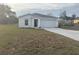 White house with a garage and spacious yard at 2322 Sw 146Th Loop, Ocala, FL 34473