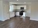 Modern kitchen featuring stainless steel appliances and granite countertops at 15937 Sw 55Th Avenue Rd, Ocala, FL 34473