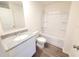 Bathroom with granite countertop vanity and shower/tub combo at 13012 Se 53Rd Ave, Belleview, FL 34420