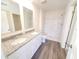 Main bathroom with double vanity and walk-in shower at 13012 Se 53Rd Ave, Belleview, FL 34420