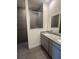 Elegant bathroom with double vanity, modern fixtures, and a glass-enclosed shower at 10776 Sw 49Th Ave, Ocala, FL 34476