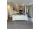 Bright kitchen featuring stainless steel appliances, stone counters, and lots of natural light at 10776 Sw 49Th Ave, Ocala, FL 34476