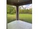 Covered patio offering a relaxing view of the lush green backyard at 10776 Sw 49Th Ave, Ocala, FL 34476
