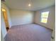 Bright bedroom with neutral carpet and ample natural light from a large window at 2408 Nw 22Nd Ct, Ocala, FL 34475