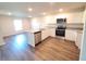 Modern kitchen featuring stainless steel appliances, granite countertops, and a functional island at 2408 Nw 22Nd Ct, Ocala, FL 34475