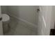 A half bathroom with a toilet featuring neutral walls and modern flooring at 5530 Sw 103Rd St Rd, Ocala, FL 34476