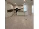 This modern kitchen features white cabinets, stainless appliances, and a breakfast bar at 5530 Sw 103Rd St Rd, Ocala, FL 34476