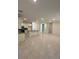 An open concept living space with recessed lighting and tile floors leads into the kitchen area at 5530 Sw 103Rd St Rd, Ocala, FL 34476