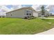 Charming one-story home featuring a well-manicured lawn and inviting curb appeal at 4323 Periwinkle Pl, Lake Hamilton, FL 33851