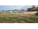 Large vacant lot with a view of surrounding homes at 1807 Don Pl, Poinciana, FL 34759