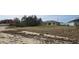 Large backyard with a view of the home's back at 1807 Don Pl, Poinciana, FL 34759