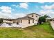 Spacious backyard with patio, retaining wall, and beautiful landscaping at 30120 Hackney Loop, Mount Dora, FL 32757