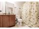 Simple bathroom with granite countertop and shower at 30120 Hackney Loop, Mount Dora, FL 32757