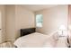 Bedroom with wood flooring, window, and a lamp at 30120 Hackney Loop, Mount Dora, FL 32757