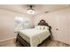 Guest bedroom with a queen bed, dresser, and plenty of closet space at 30120 Hackney Loop, Mount Dora, FL 32757
