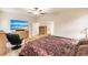 Main bedroom with large TV and ample closet space at 30120 Hackney Loop, Mount Dora, FL 32757