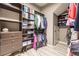 Large walk-in closet with custom shelving and drawers at 30120 Hackney Loop, Mount Dora, FL 32757