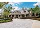 Community clubhouse with stone accents and a metal roof at 30120 Hackney Loop, Mount Dora, FL 32757