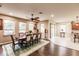 Open dining room with hardwood floors and view of kitchen at 30120 Hackney Loop, Mount Dora, FL 32757