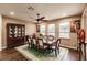 Formal dining room features hardwood floors and a ceiling fan at 30120 Hackney Loop, Mount Dora, FL 32757