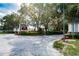 Community entrance with brick columns and lush landscaping at 30120 Hackney Loop, Mount Dora, FL 32757