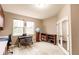 Bright home office features built-in shelving and large windows at 30120 Hackney Loop, Mount Dora, FL 32757