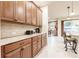 Kitchen features granite countertops and extensive wood cabinetry at 30120 Hackney Loop, Mount Dora, FL 32757