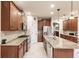 Open concept kitchen boasts granite countertops and stainless steel appliances at 30120 Hackney Loop, Mount Dora, FL 32757