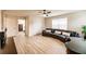 Spacious living room with sectional sofa and access to bedroom at 30120 Hackney Loop, Mount Dora, FL 32757