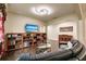 Living room with sectional sofa, built-in shelving, and hardwood floors at 30120 Hackney Loop, Mount Dora, FL 32757